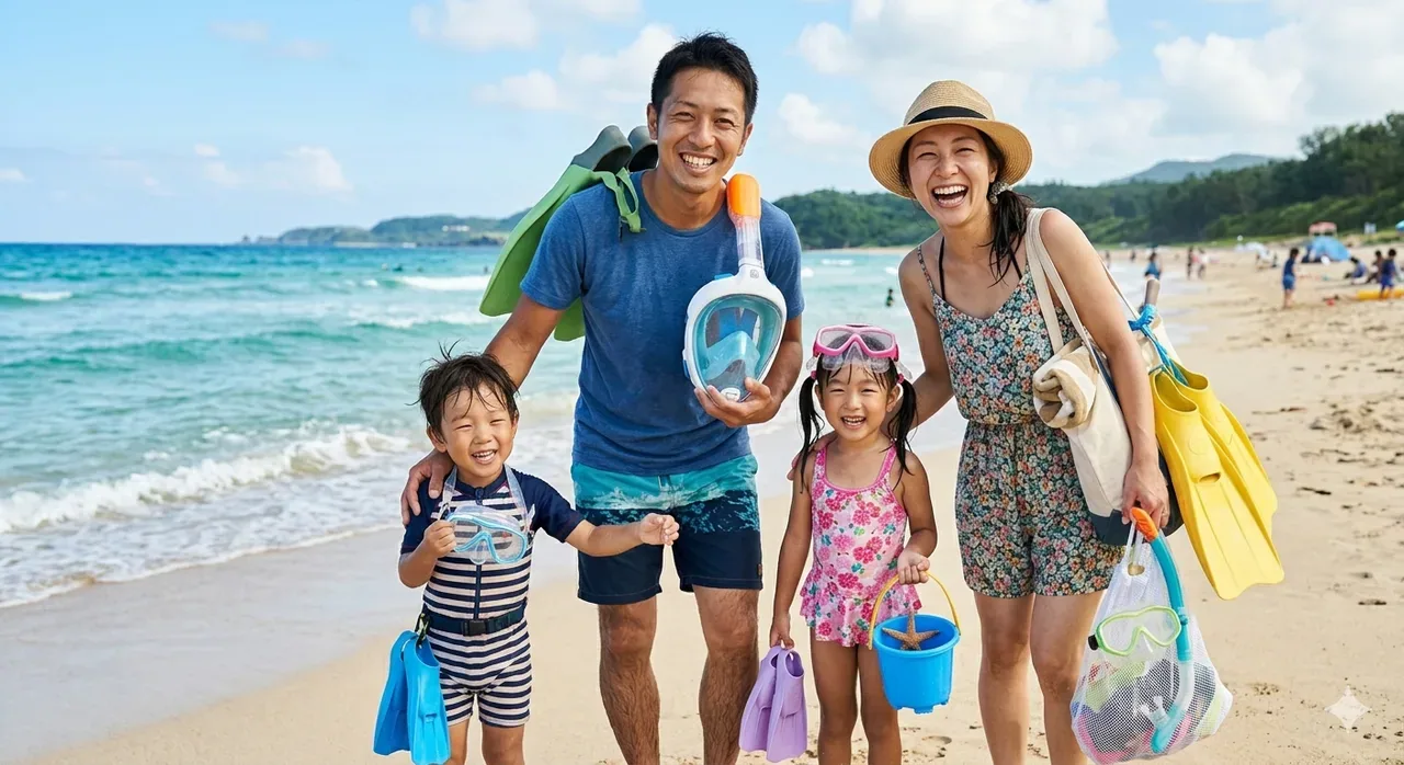 子供連れ家族がシュノーケル道具を持って海岸で笑顔